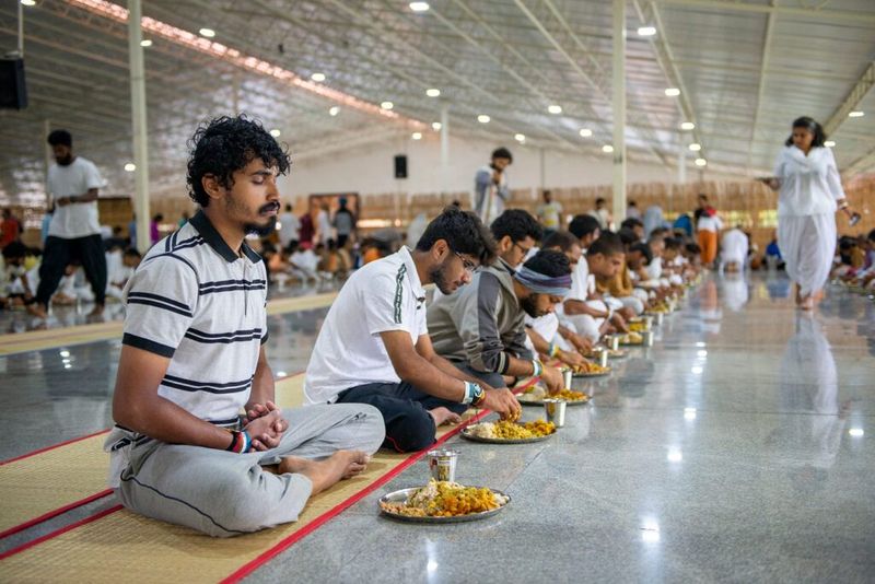 Diners in Biksha Hall seated for a meal